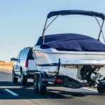 Truck towing a  boat on the interstate, California